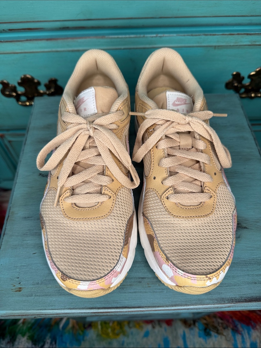 Nike Women's Beige Athletic Sneakers with Subtle Pink Accent